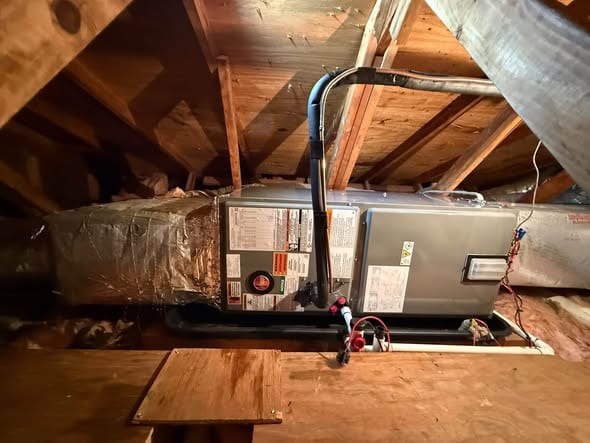 New attic air handler set between the rafters with its line set run