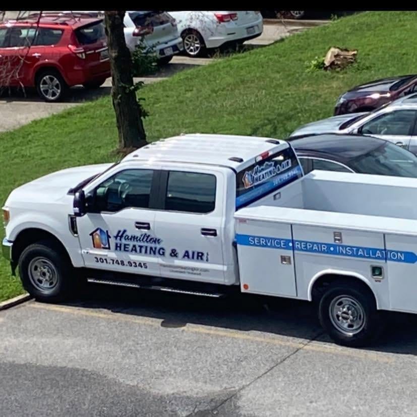 Hamilton Heating & Air service truck with its utility body, parked at a job