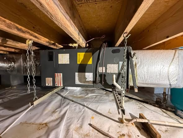Crawlspace air handler hung on chains with new duct connections